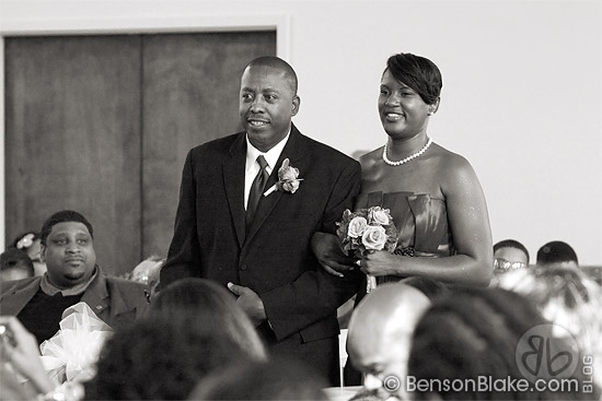 Groomsman and bridesmaid walking down the aisle
