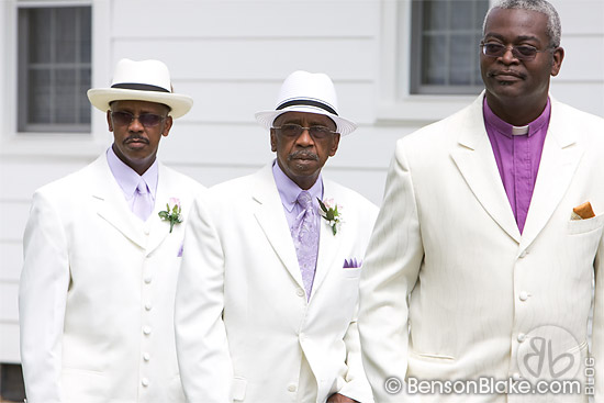 The pastor, Archie and the best man entering the ceremony