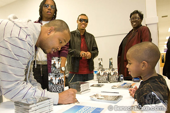 Members of God's Image signing autographs