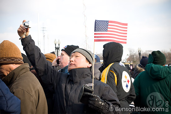 Man capturing a view of the Inauguration parade route
